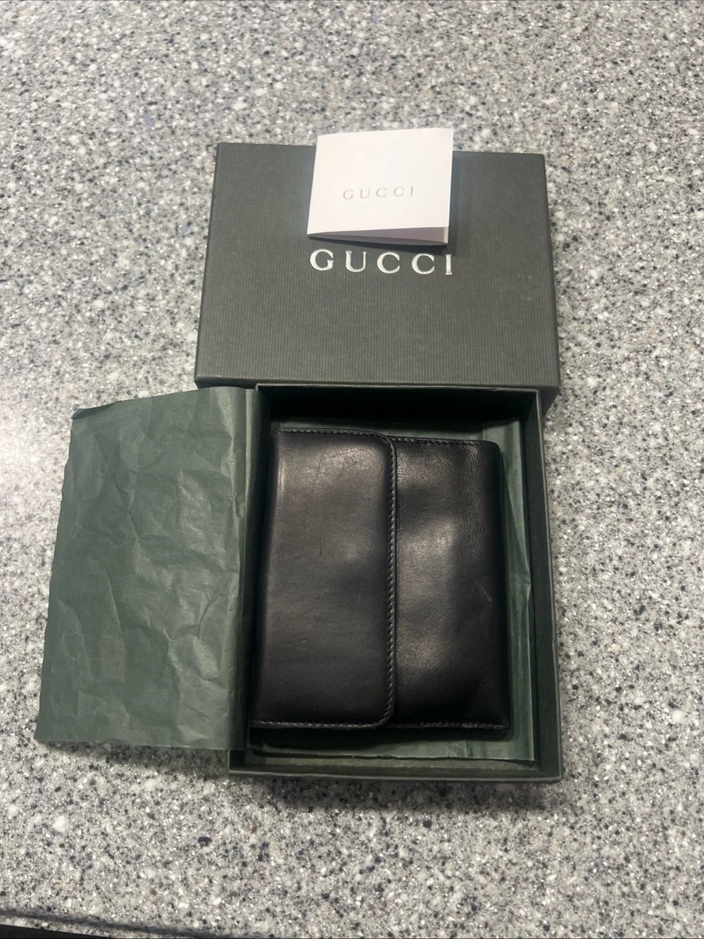 Gucci Black Leather Bifold Card Holder with Silver G-Clip Accent